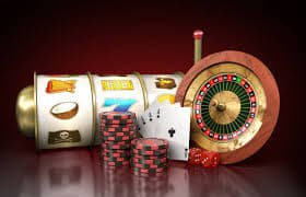 Filipino player holding phone with okebet slot app open showing sportsbook and casino